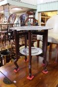 Chinese silvered metal two tier tray table, the two trays on a carved hardwood folding stand,