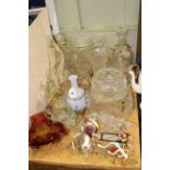 Collection of glassware including decanters, vases, bowls,