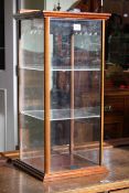 Table top display cabinet with sliding glazed panel front,