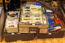 Three boxes of model vehicles