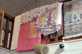 Four various quilts and floral cushion cover