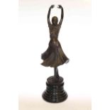 Modern bronze of Art Deco style dancing lady on marble plinths,