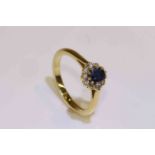 18 carat yellow gold oval sapphire and round brilliant diamond cluster ring