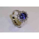 18 carat oval tanzanite and round brilliant diamond cluster ring, tanzanite approximately 2.