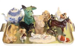 Collection of dog figures and white teapot