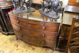 19th Century mahogany bow front chest having brush slide above three long drawers on splayed legs,