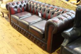 Ox blood deep buttoned leather three seater Chesterfield settee