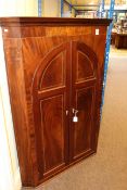 Early 19th Century inlaid mahogany corner wall cupboard with arched double doors