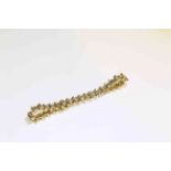 14 carat yellow gold and round brilliant diamond bracelet, total diamond weight approximately 5.