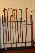 Snooker cue rack, various walking sticks, cue rest,