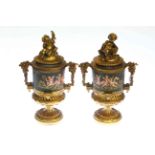 Pair of gilt metal urns and covers,