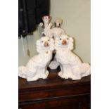 Pair of Staffordshire dogs and spill figure group