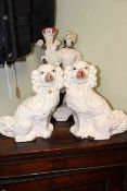 Pair of Staffordshire dogs and spill figure group