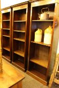 Set of three mahogany and satinwood banded open bookcases with adjustable shelves