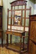 Late Victorian/Early 20th Century oak hallstand having mirror and tiled back,