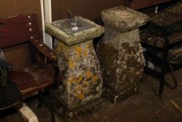 Pair of weathered stone pedestals, one with sundial top,