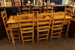 Pine turned leg kitchen table and eight rush seated ladder back chairs