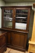 Early 20th Century walnut four door cabinet bookcase