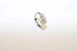 Three-stone diamond and platinum ring,