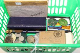 Collection of medals and badges and book of autographs