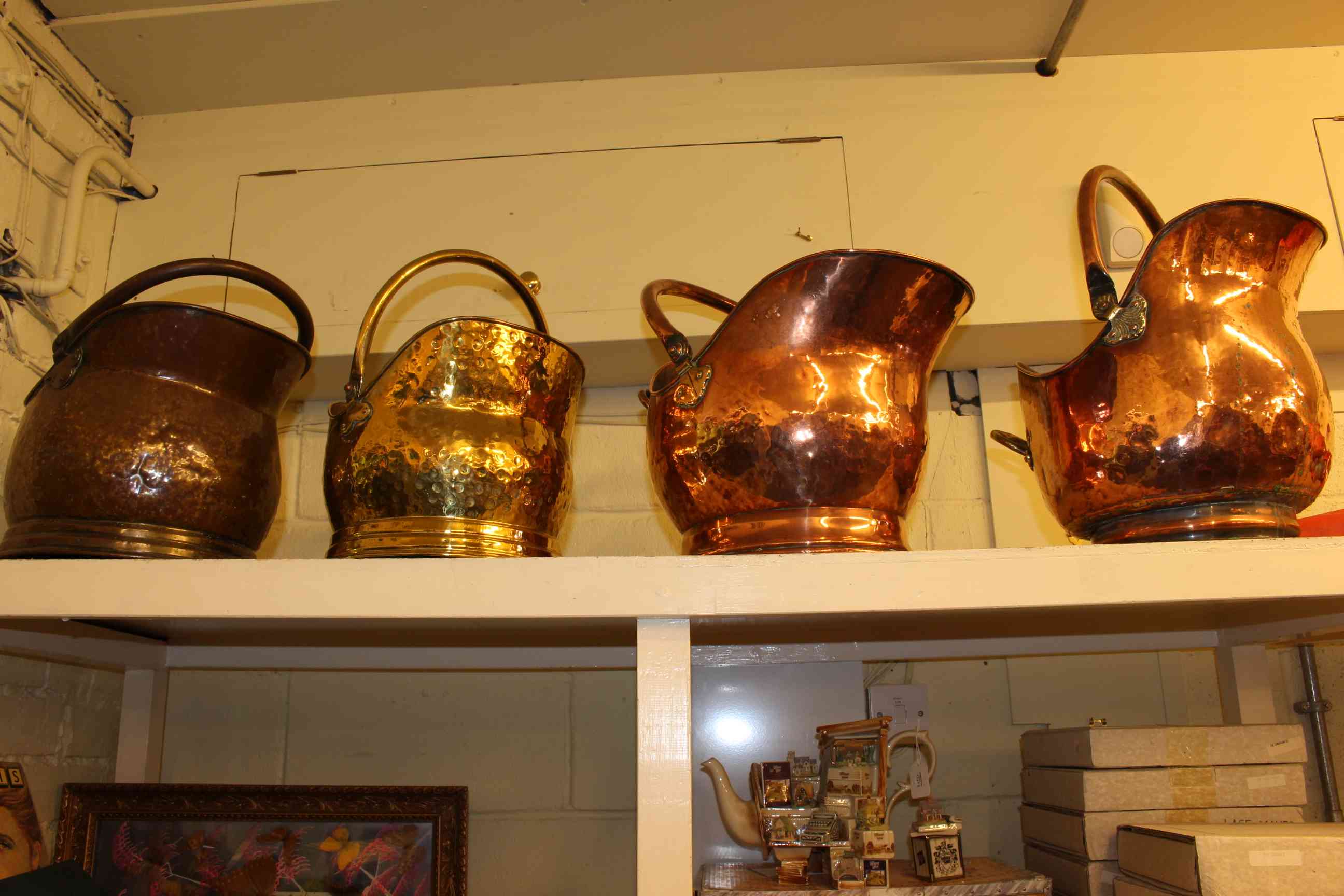 Three copper and one brass coal helmets