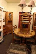 Ducal pine oval extending dining table and six chairs, glazed door top corner cabinet, wall shelf,