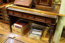 Victorian mahogany two drawer writing table on turned legs,