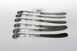 Set of six silver-handled knives with pistol handles