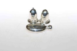 Pair of silver salt and peppers and a small silver flask (3)