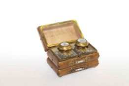 Continental leather casket containing a pair of scent bottles with gilt metal and enamel painted