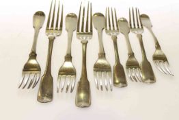 Five silver table forks and four silver dessert forks,