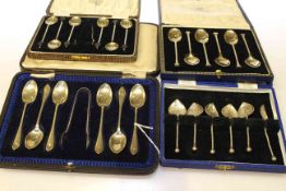 Four cased sets of silver spoons