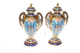 Pair of Noritake vases and covers, 22.