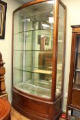 Early 20th Century mahogany bow front shop display cabinet,