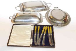 Three silver plated entree dishes and cased knives