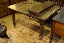 Late 19th/early 20th Century mahogany extending dining table and two leaves on turned reeded legs