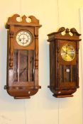 Two oak cased wall clocks