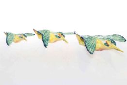 Three Beswick kingfishers in flight