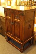 Old Charm carved and linen fold two door television cabinet on turned legs,