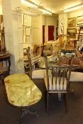 Wrought metal and glass topped table and four chairs,