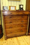 Victorian mahogany chest of five long drawers with turned pillars,