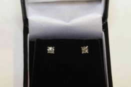 Pair of 18 carat gold and brilliant-cut diamond stud earrings, total diamond weight approximately 0.