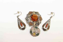Two Scottish agate and silver brooches and a pair of agate and silver earrings
