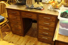 Early 20th Century oak eleven drawer pedestal desk,