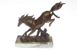 Bronze model of a bucking horse on marble plinth