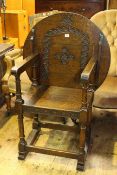 Carved oak circular backed monks chair