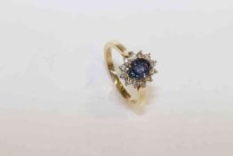 18 carat yellow gold, oval sapphire and round brilliant diamond cluster ring,