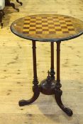 Victorian circular walnut games table on triform base