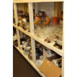 Child's high chair and full shelf and a half of glass, china, metalware, cutlery, collectors plates,