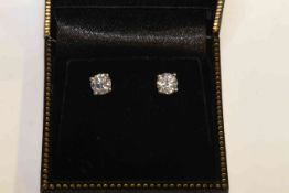 Pair of 18 carat gold and brilliant-cut diamond stud earrings,
